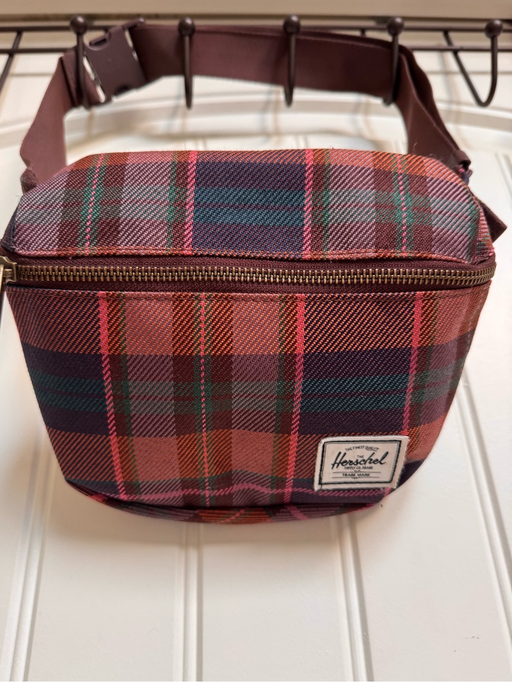 Herschel Fifteen Hip Pack in Pink Tartan. 8” by 6.5” by 1”